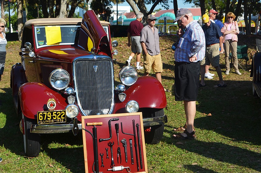 Dwaine Arney checks out the classic antique cars on display at St. Armands Circle Park.