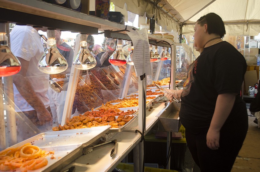 Aleah Burrio works during the Sarasota Seafood and Music Festival.