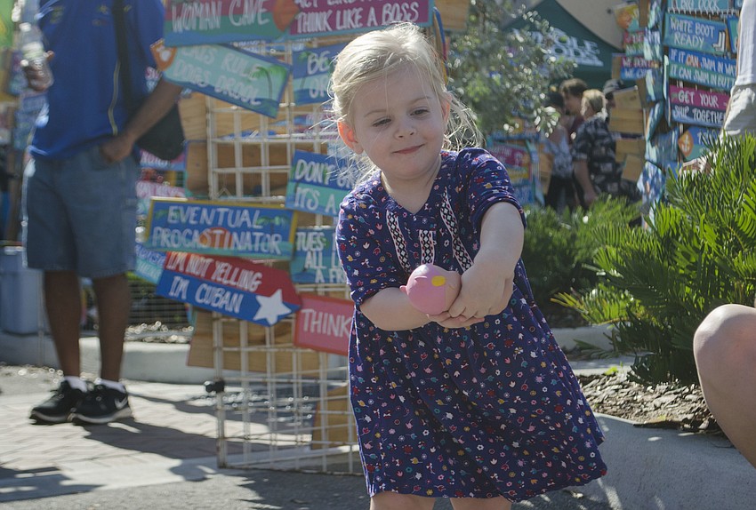 Charlotte Cook dances near the main stage at the Sarasota Seafood and Music Festival.