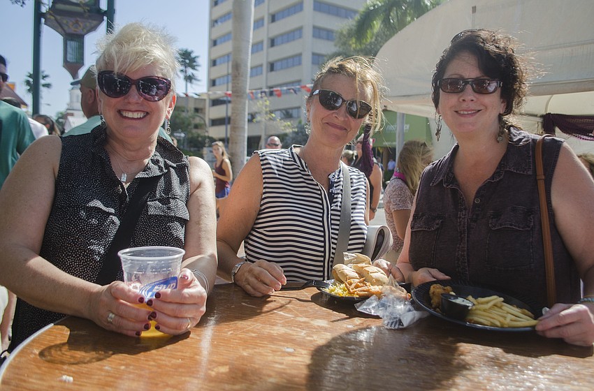 Kaye Stewart, Rose Paolicelli and Patricia Zink enjoy seafood from Walts
