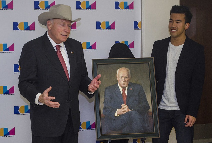 Vice President Dick Cheney stands with Ringling College of Art and Design student Jeffrey Nguyen. Nguyen painted a portrait of the former vice president, which was presented to him during the event.