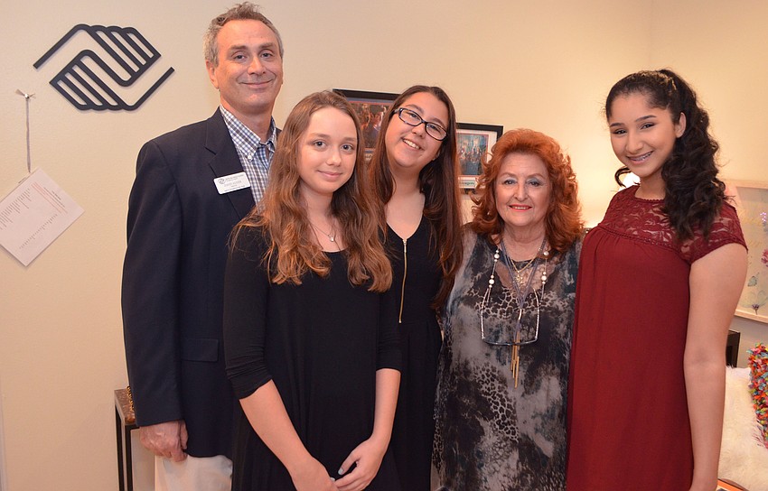 David Auxier, director of career development for Boys & Girls Clubs of Sarasota County, with  Boys & Girls Clubs of Sarasota County members Christina Polokonis and Kat Barbieri with Cheri Pachter and club member Fatima Demlak
