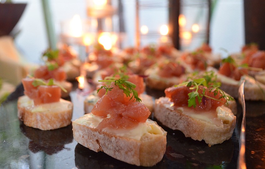 Several hors d’oeuvres such as this quince relish smoked trout with goat cheese served on a crostini were made by Chef Mara Cristiani and her team at Laurel Oak Country Club.