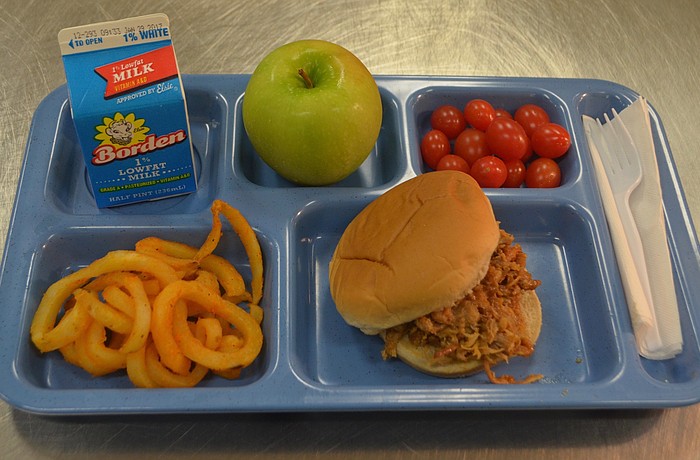 A typical lunch at Gilbert W. McNeal Elementary School sits on a tray ready to be served. The lunch meets all nutritional requirements.