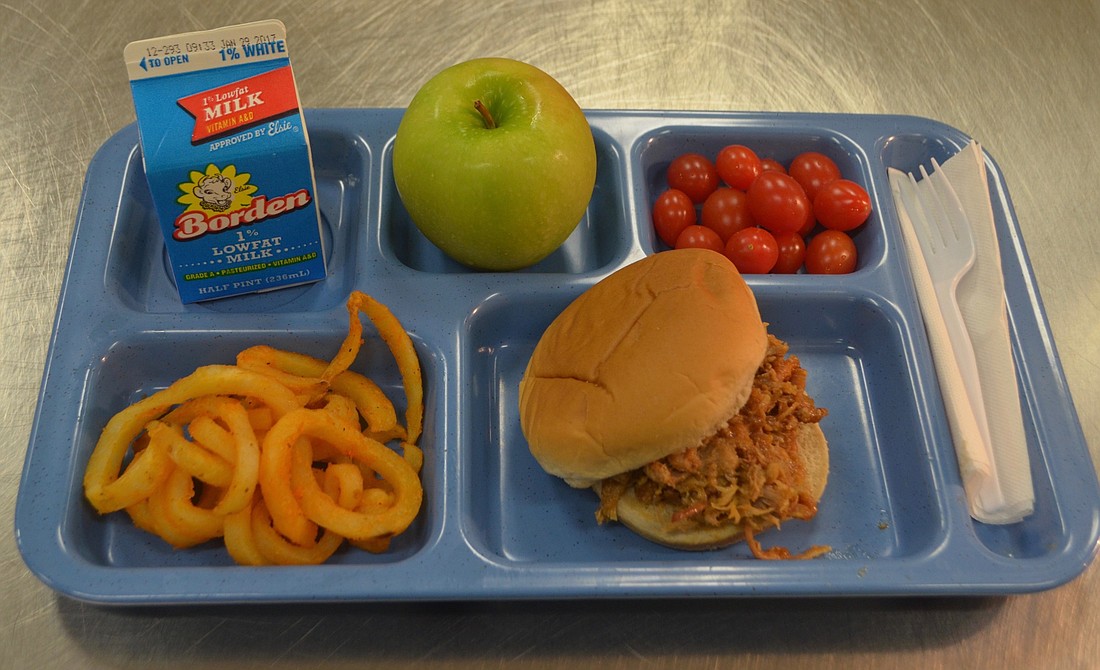 A typical lunch at Gilbert W. McNeal Elementary School sits on a tray ready to be served. The lunch meets all nutritional requirements.