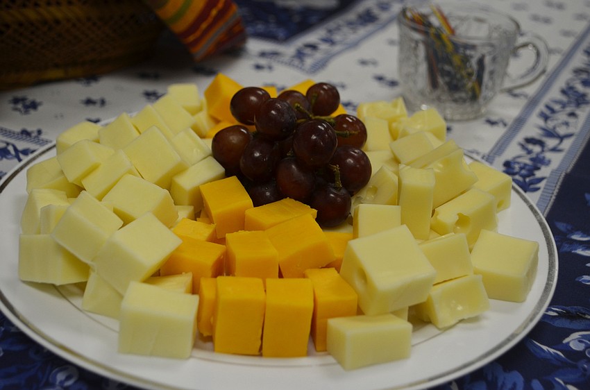 Attendees enjoyed assorted fruits and cheeses with their wine.