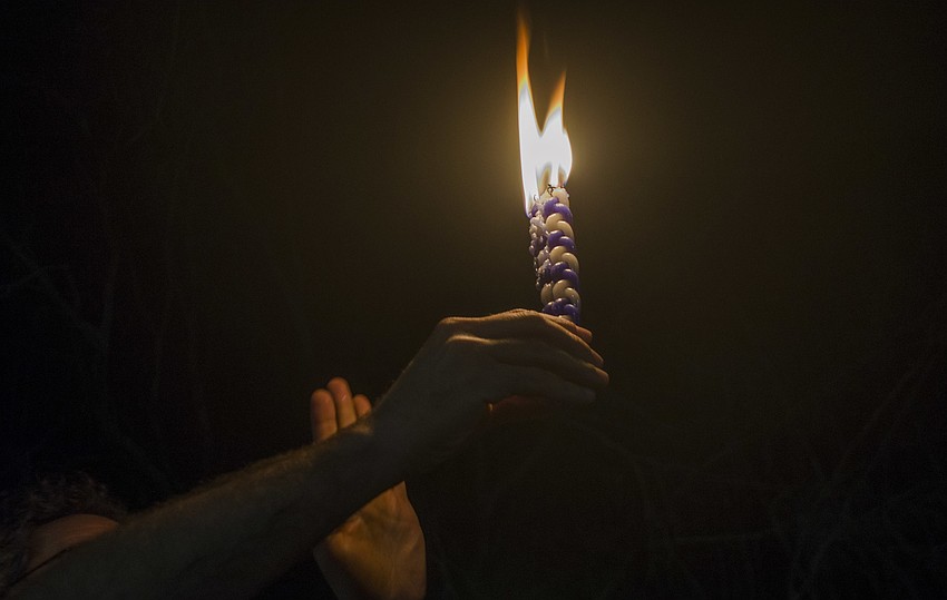 Before the movie attendees went outside to participate in Havdalah. The ritual marks the end of Shabbat, the Jewish Sabbath.