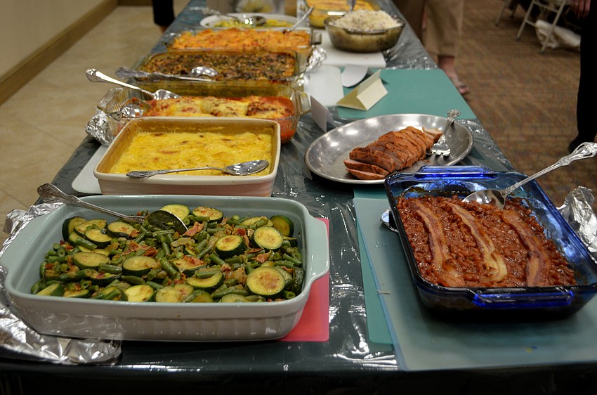 The church’s fellowship hall was packed with three tables of food and 100 members for the potluck dinner on Jan. 25.