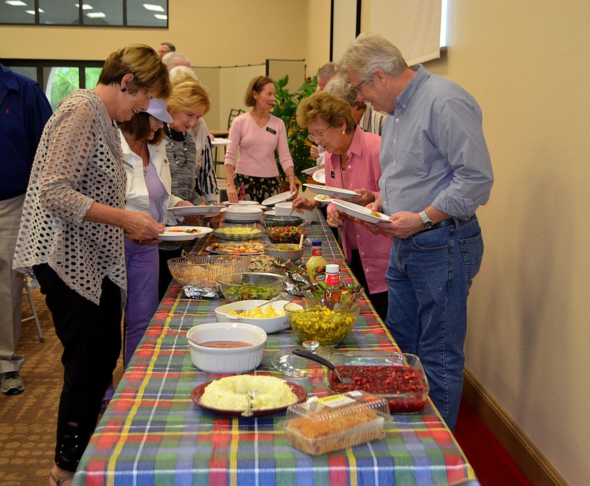 The church’s fellowship hall was packed with three tables of food and 100 members for the potluck dinner on Jan. 25.