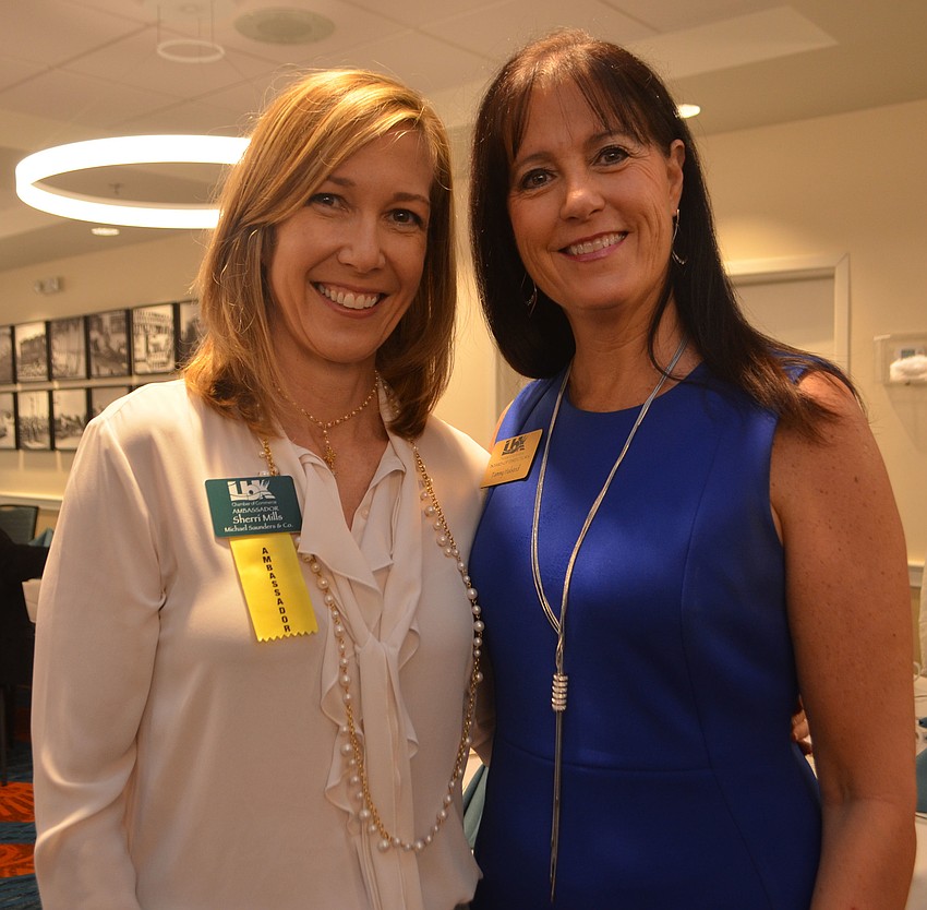 Sherri Mills of Michael Saunders & Co., and 2016 Chamber Chairwoman Tammy Halsted