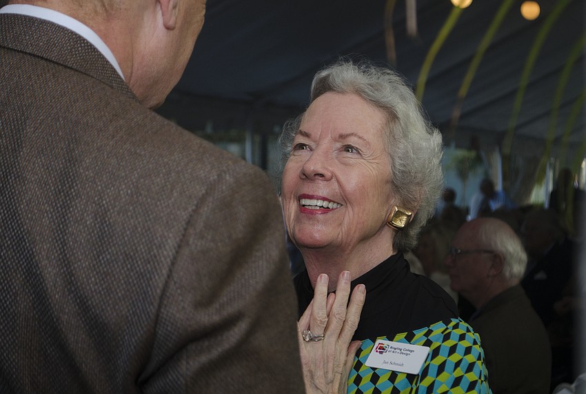 Jan Schmidt congratulates Ringling College President Larry Thompson on the grand opening of the Alfred R. Goldstein Library.