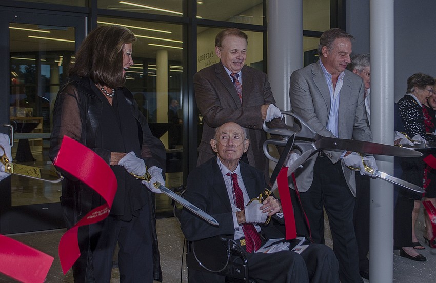 Alfred R. Goldstein and Larry Thompson cut the ribbon on the Alfred R. Goldstein Library.