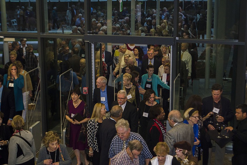 Patrons of Ringling College Art and Design and the Ringling College Library Association flood into the newly opened library.