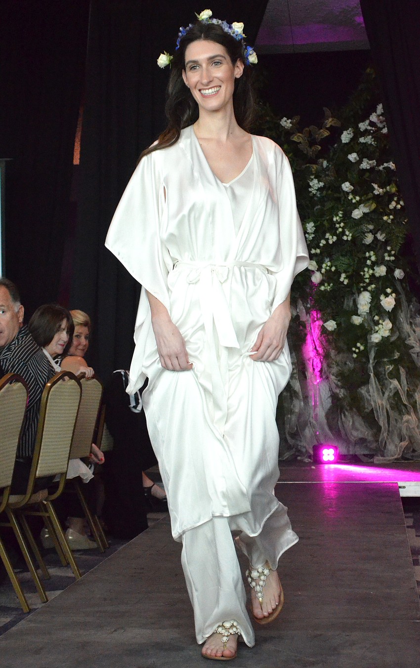 Emily Fernands walks the runway in a Karen Roth Eco-luxe Resort & Loungewear dress.