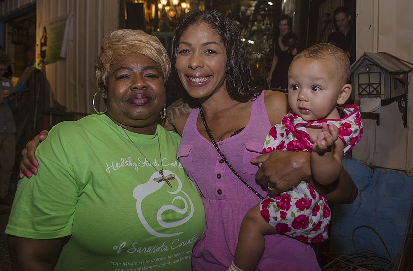 Beverly Phelps, Tierrany Boyle and Monroe Mitchell. Phelps is a Save my Life program, which teaches safety, breastfeeding and childbirth. Boyle participated in the program when pregnant with her daughter, Monroe Mitchell.