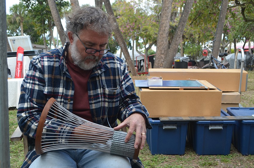 James Mosler makes a vessel out of aluminum. He was one of more than 175 artists who displayed work at St. Armands Circle over the weekend.