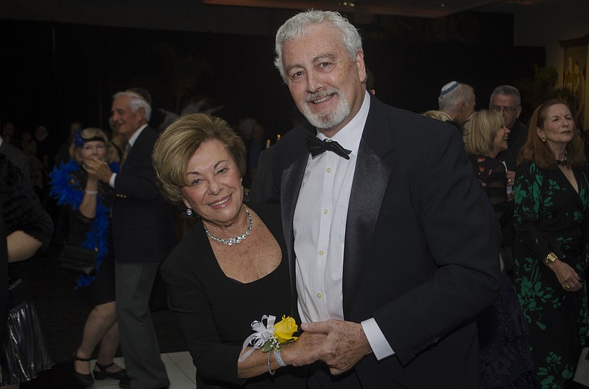 Rifka Glatz and Eddie Kay dance during the event.