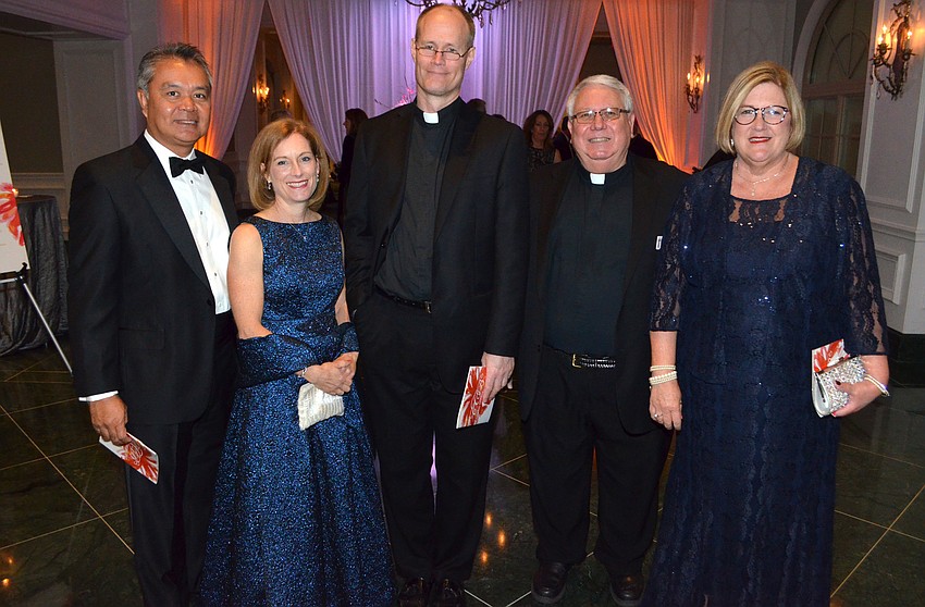 Noel and Erica Maun, Priest Mark Ruckpaul, Deacon Jim Hanks and his wife, Susan Hanks