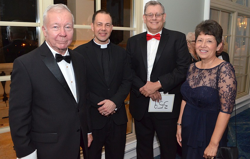 Richard Kuzmich, Father Lawton Lang and Mark and Patricia Sellner