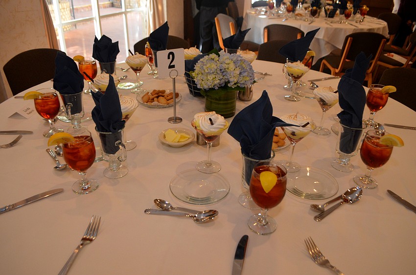 Each table was set with fruit cocktails awaiting attendees.
