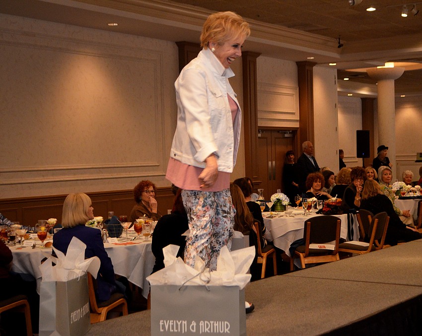 Molly Schechter is all smiles as she walks the runway during Beth Israel Women’s fashion show.