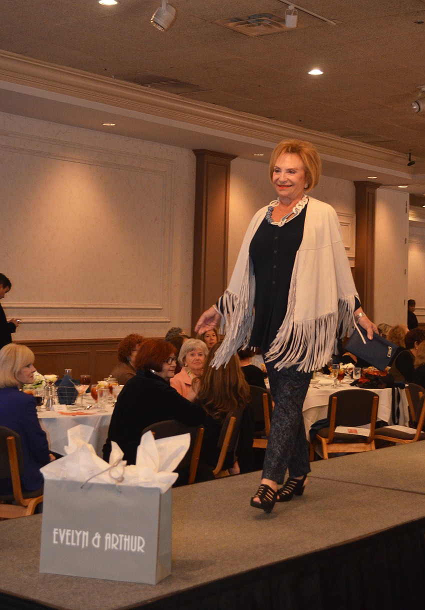 Marion Levine smiles as she walks the runway during Beth Israel Women’s fashion show.