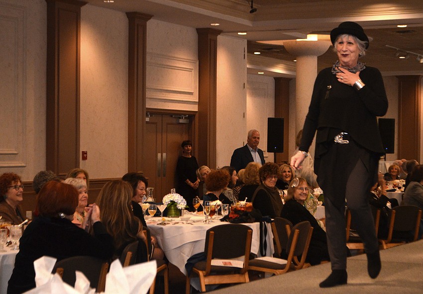 Co-Chairwoman Sylvia Pastor takes a turn walking the runway.