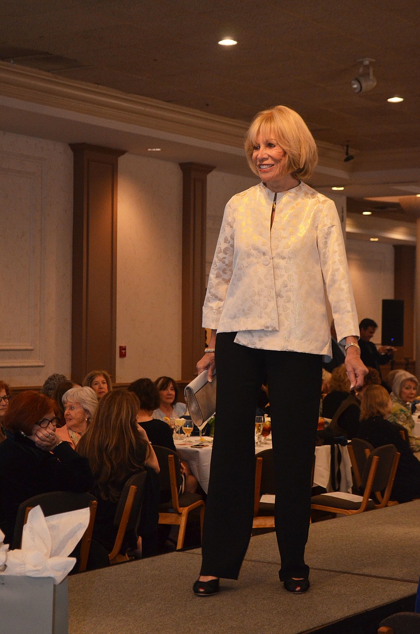 Terry Weis works the runway during the annual fashion show.