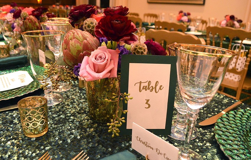 The color scheme for the dinner was emerald and gold, which was partially inspired by the color of the artwork and other decor in the Findlay’s penthouse.