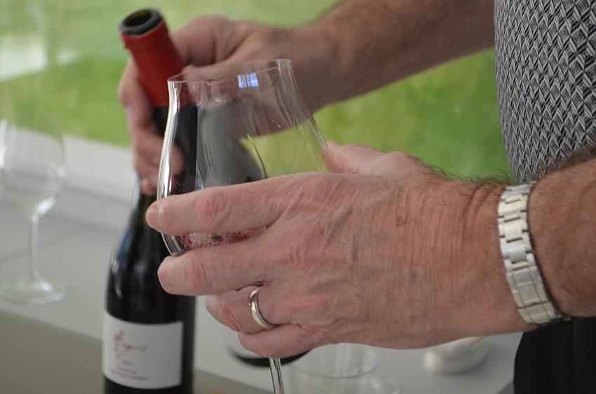 George Muller pours himself a sample of pinot noir.