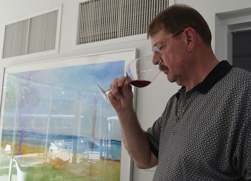 George Muller tests one of the three pinot noirs. Attendees sipped on Williamette, Bon Pari and Argus pinot noirs.