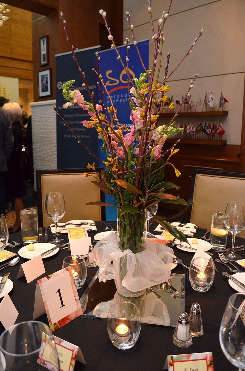 Each table was adorned with a floral centerpiece at the Anu and Friends dinner on Jan. 31 at Sarasota Yacht Club.
