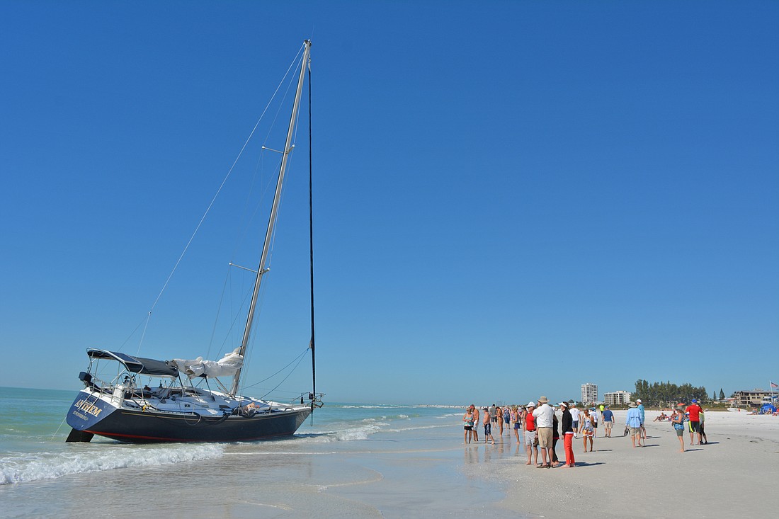 A large sailboat ran aground on Siesta Key Beach this week.