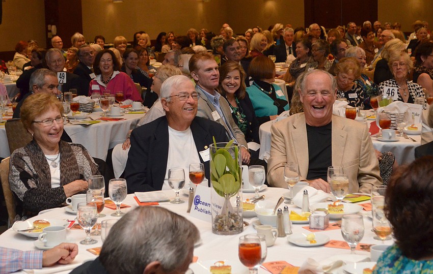 Guests laugh while listening to Dave Barry speak.