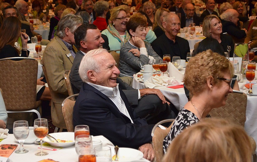 Chuck Barancik laughs while listening to Dave Barry speak.