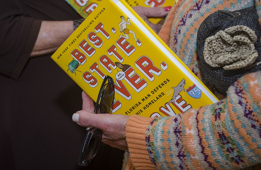Mary Lou Winnick holds a copy of Dave Barry'     s most recent book 