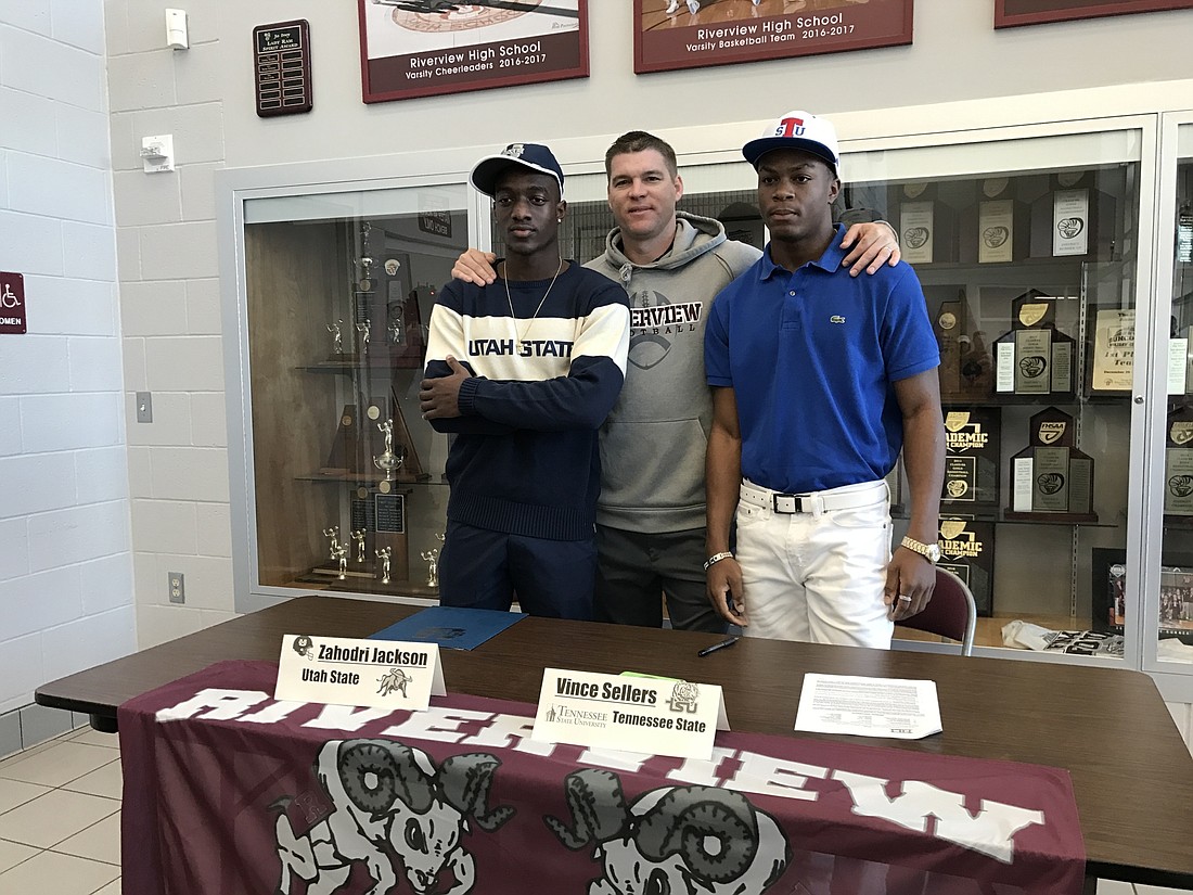 Zahodri Jackson, coach Todd Johnson and Vince Sellers, Jr. Photo courtesy Jay Lorenz.