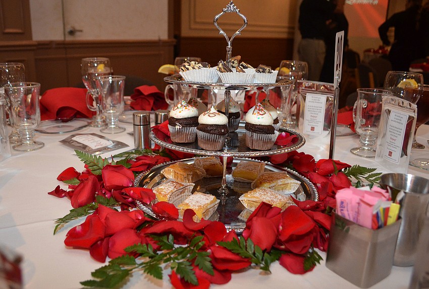 Each table at the Michael’s On East ballroom was topped with roses and a dessert tray Feb. 1 at the Junior League of Sarasota Legacy Luncheon.