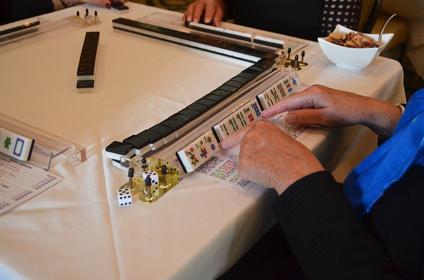 Attendees of the Go for the Cure Games day brought their own games, such as mahjong, to play with their tables.