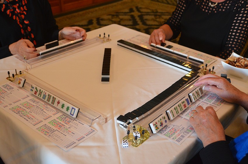 Attendees of the Go for the Cure Games day brought their own games, such as mahjong, to play with their tables.