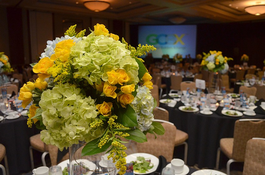 Each table at the Gulf Coast Builders Xchange 65th Annual Installation and Awards Dinner at Hyatt Regency Sarasota was adorned with a green and yellow floral centerpiece on Feb. 1.