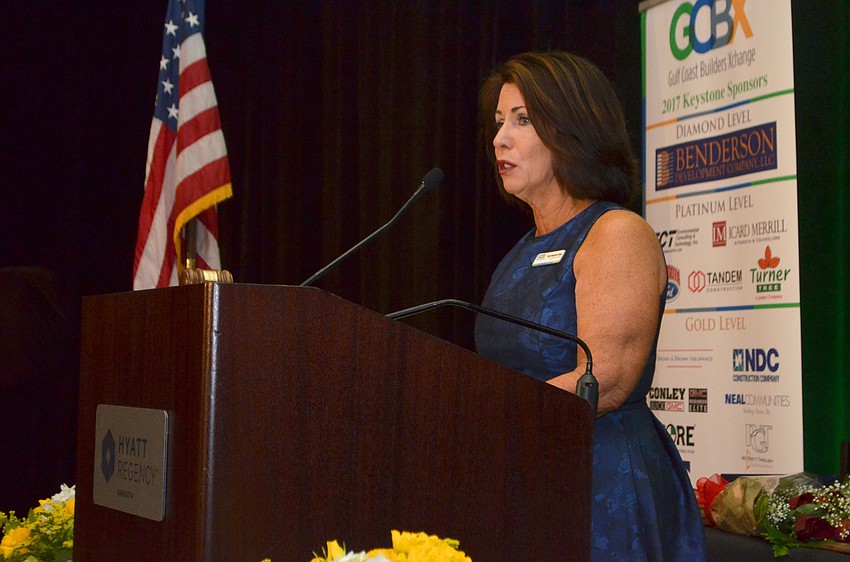 Gulf Coast Builders Xchange Executive Director Mary Dougherty-Slapp welcomes attendees.