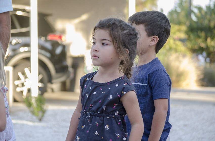Olivia Daley watches as the Budweiser Clydesdales begin their parade down Ocean Boulevard.