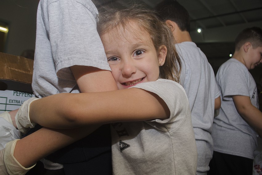 Sophia Antico hugs her buddy Addyson Rudd.