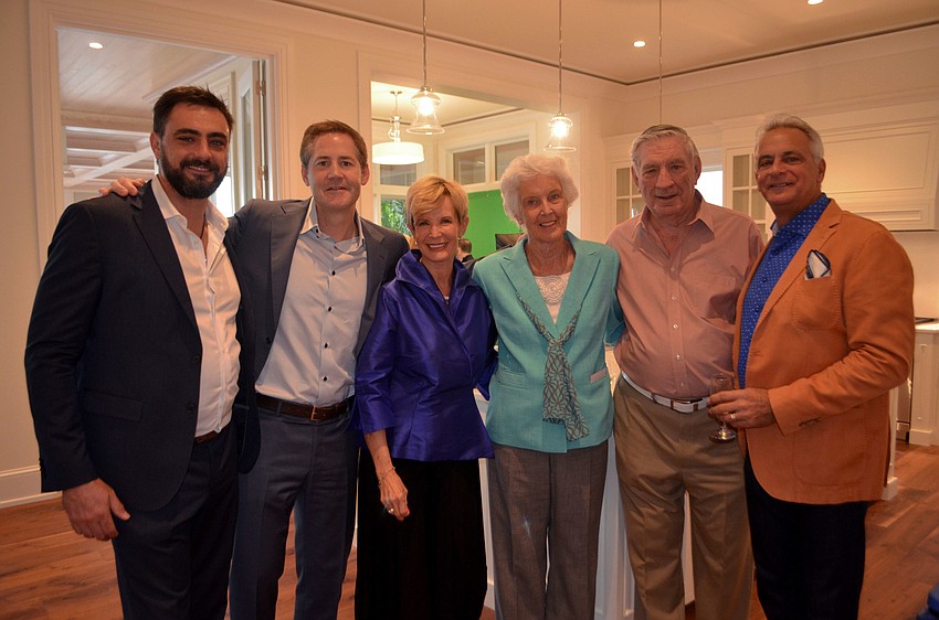 Ricky Perrone of Perrone Construction, Wes Neichenbauer, Coldwell Banker Residential Real Esate Agent Lynne Koy, Betty and Bryan Rowntree of Rowntree Enterprises and Richard Perrone of Perrone Construction