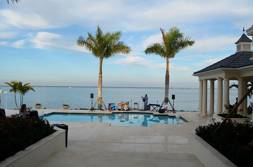 The approximately one-acre estate overlooks the Sarasota Bay and has five bedrooms and five-and-a-half baths.