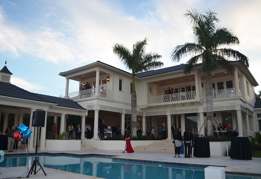 The approximately one-acre estate overlooks the Sarasota Bay and has five bedrooms and five-and-a-half baths.