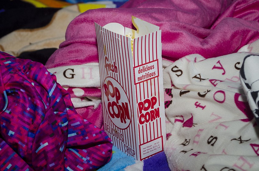 Attendees munched on popcorn as they spread their blankets on the lawn.