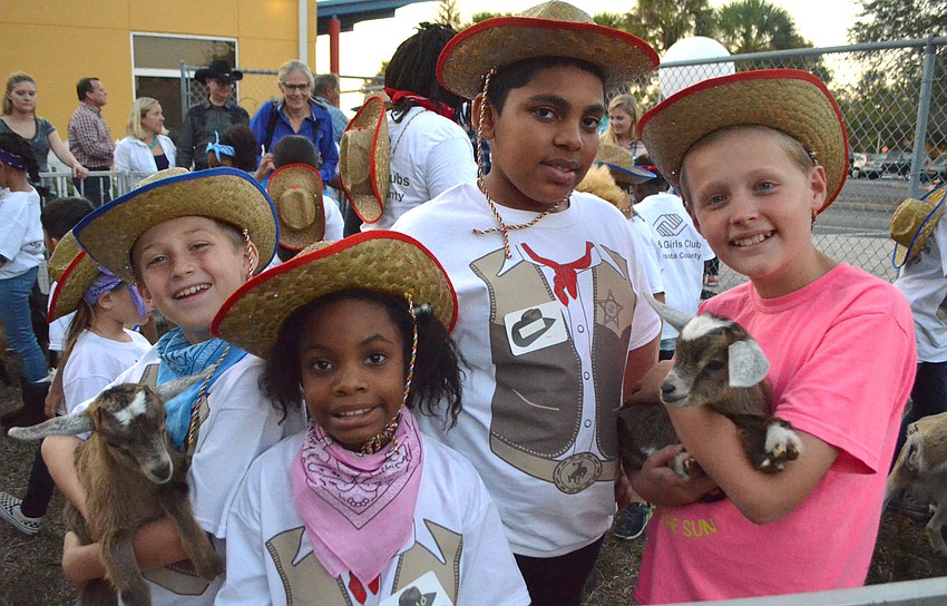 Max H., Myla S., Daryl W. and Tristan K. enjoy some quality time with the animals from Rosaire’s Riding Academy.