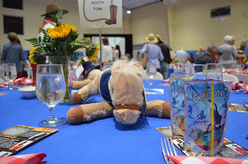 Guests at Steak and Burger were told to follow the dress code of “western casual” — which carried through in the decor inside the gymnasium — for the event at Lee Wetherington Club on Feb. 3.